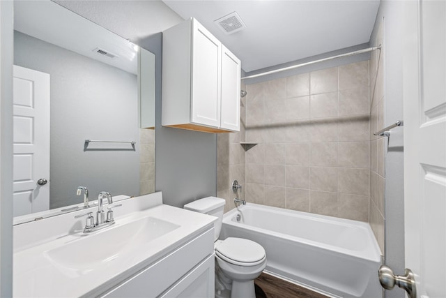 2030 Boreas Ln, Baytown, TX 77523 - full bathroom featuring toilet,  shower combination, vanity, and wood finished floors