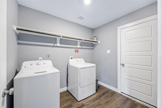 2030 Boreas Ln, Baytown, TX 77523 - laundry area with washing machine and clothes dryer, dark wood-style flooring, and baseboards