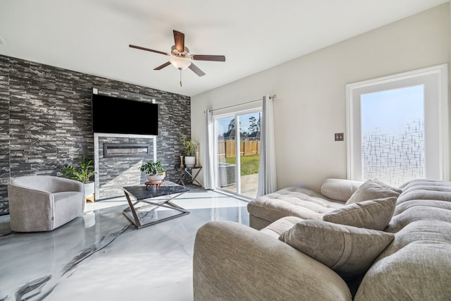 15203 Albert Oak Dr, Humble, TX 77396 - living area with a glass covered fireplace, ceiling fan, and finished concrete flooring