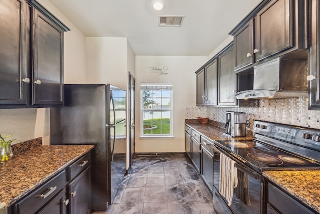 15203 Albert Oak Dr, Humble, TX 77396 - kitchen featuring black range with electric cooktop, decorative backsplash, dark stone counters, and freestanding refrigerator