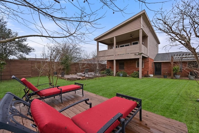 2402 Pine St, Galveston, TX 77551 - rear view of property with a balcony, a ceiling fan, a wooden deck, and brick siding