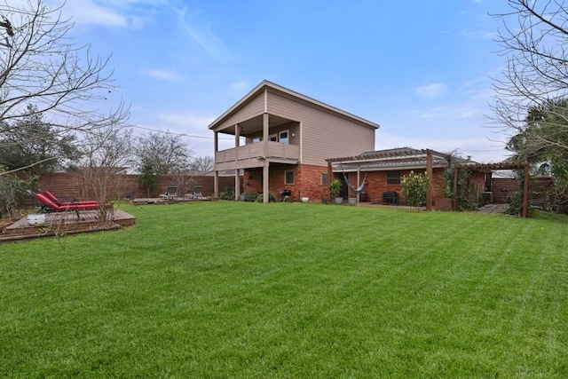 2402 Pine St, Galveston, TX 77551 - rear view of property featuring a balcony, a pergola, and brick siding