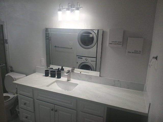 12500 Sandpiper Dr Unit 66, Houston, TX 77035 - bathroom with stacked washing machine and dryer and vanity