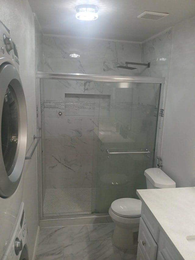 12500 Sandpiper Dr Unit 66, Houston, TX 77035 - full bathroom with marble finish floors, stacked washer and clothes dryer, a shower stall, and vanity