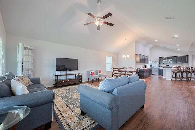 21018 Whitehaven Bluff Trl, Katy, TX 77449 - living room featuring vaulted ceiling, ceiling fan, dark wood-style flooring, recessed lighting, and a chandelier