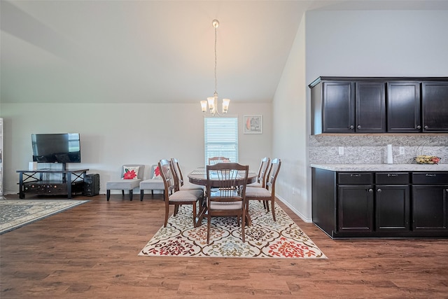 21018 Whitehaven Bluff Trl, Katy, TX 77449 - dining space featuring lofted ceiling, a chandelier, and wood finished floors