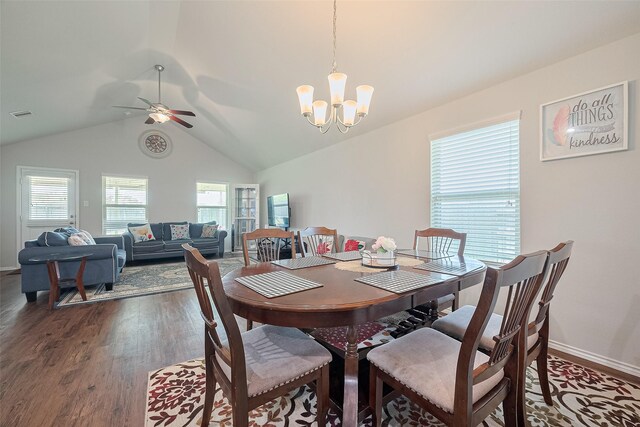21018 Whitehaven Bluff Trl, Katy, TX 77449 - dining room with a chandelier, dark wood-style floors, lofted ceiling, ceiling fan, and baseboards
