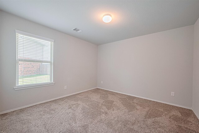 21018 Whitehaven Bluff Trl, Katy, TX 77449 - spare room with carpet and baseboards