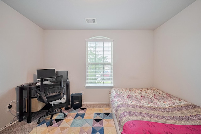 21018 Whitehaven Bluff Trl, Katy, TX 77449 - bedroom with light colored carpet, baseboards, and an office area