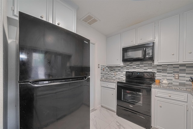 13798 Hollowgreen Dr Unit 305, Houston, TX 77082 - kitchen with black appliances, white cabinetry, light marble finish flooring, decorative backsplash, and light stone counters