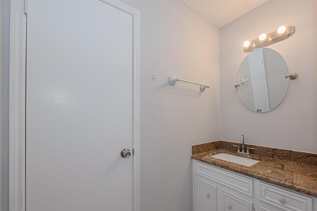 13798 Hollowgreen Dr Unit 305, Houston, TX 77082 - bathroom featuring vanity and a textured ceiling