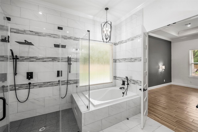 58-D Hickory Ridge Dr, Huffman, TX 77336 - full bath with ornamental molding, a garden tub, a stall shower, a chandelier, and baseboards
