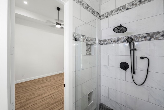 58-D Hickory Ridge Dr, Huffman, TX 77336 - bathroom with wood finished floors, a tile shower, baseboards, and a ceiling fan