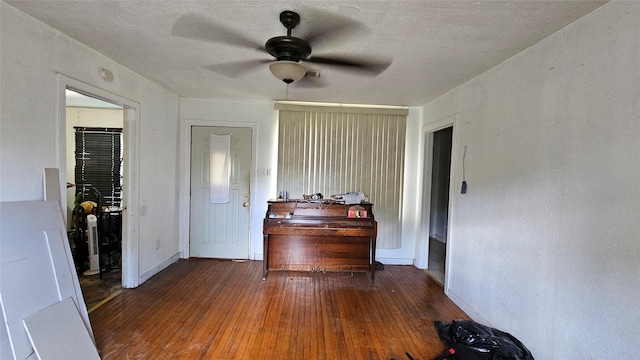 7622 Delavan Dr, Houston, TX 77028 - interior space featuring a ceiling fan, hardwood / wood-style flooring, baseboards, and a textured ceiling