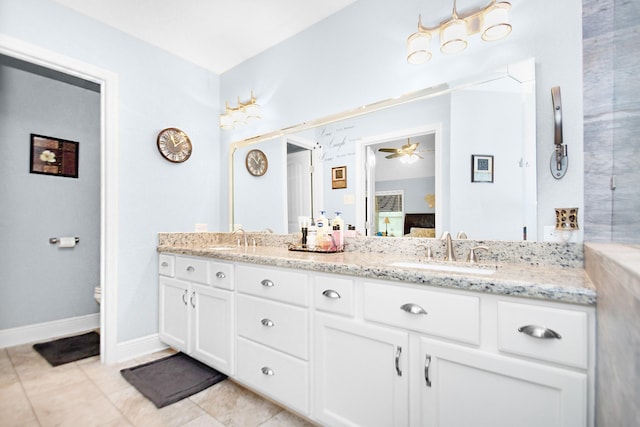 120 Brazos River Rd Unit 400, Freeport, TX 77541 - ensuite bathroom with double vanity, ceiling fan, and tile patterned flooring