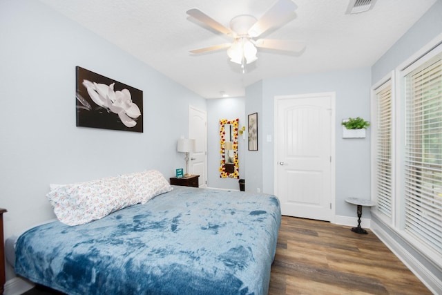 120 Brazos River Rd Unit 400, Freeport, TX 77541 - bedroom featuring wood finished floors and a ceiling fan