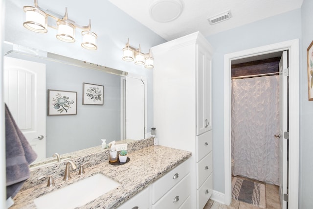 120 Brazos River Rd Unit 400, Freeport, TX 77541 - bathroom with vanity, a shower with curtain, and tile patterned flooring