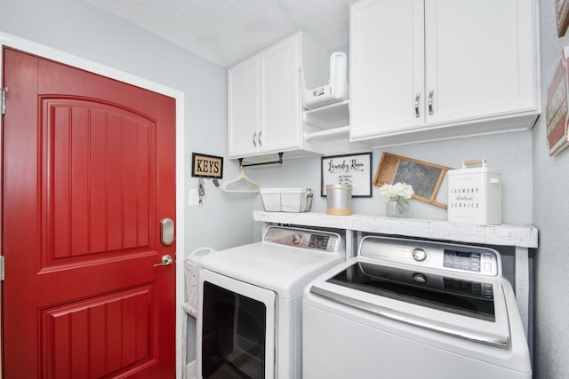 120 Brazos River Rd Unit 400, Freeport, TX 77541 - laundry area with cabinet space and separate washer and dryer