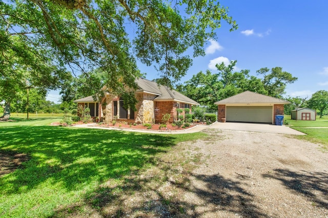 120 Brazos River Rd Unit 400, Freeport, TX 77541 - view of front of house with a storage shed, a front lawn, dirt driveway, a garage, and brick siding