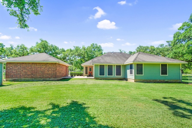 120 Brazos River Rd Unit 400, Freeport, TX 77541 - rear view of house with a yard and a patio area