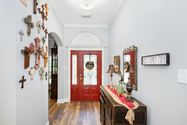 120 Brazos River Rd Unit 400, Freeport, TX 77541 - entrance foyer with ornamental molding, wood finished floors, and arched walkways