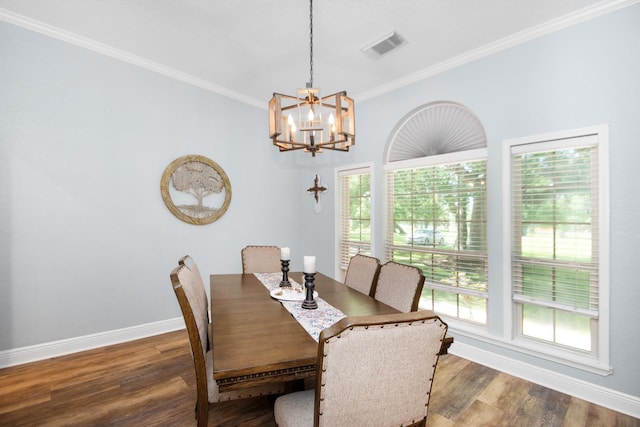 120 Brazos River Rd Unit 400, Freeport, TX 77541 - dining room with a chandelier, plenty of natural light, wood finished floors, and ornamental molding