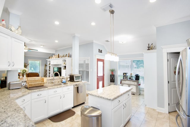 120 Brazos River Rd Unit 400, Freeport, TX 77541 - kitchen featuring stainless steel appliances, ornamental molding, white cabinets, recessed lighting, and light stone countertops