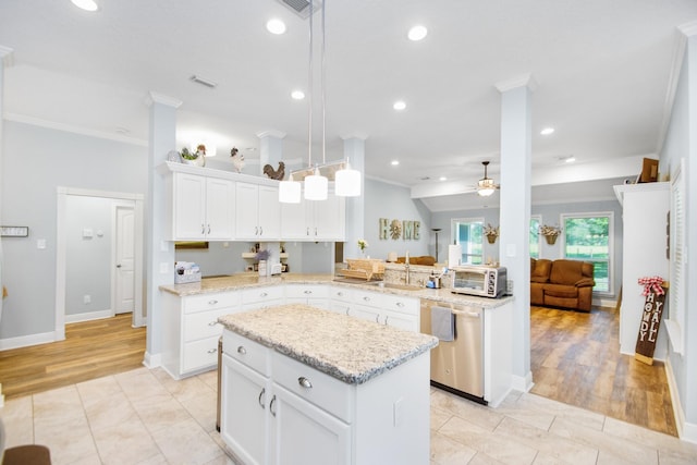 120 Brazos River Rd Unit 400, Freeport, TX 77541 - kitchen featuring dishwasher, crown molding, ceiling fan, a peninsula, and a kitchen island