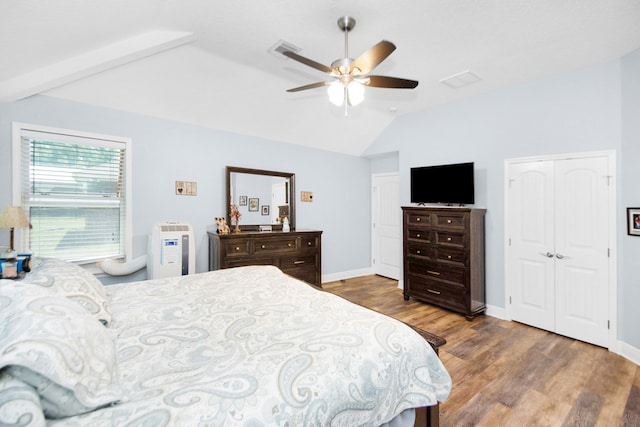 120 Brazos River Rd Unit 400, Freeport, TX 77541 - bedroom with vaulted ceiling, wood finished floors, and ceiling fan
