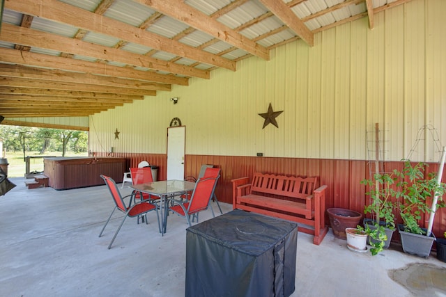 120 Brazos River Rd Unit 400, Freeport, TX 77541 - view of patio / terrace featuring a hot tub and outdoor dining space
