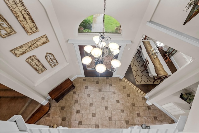 9030 Royal Crest Ln, Richmond, TX 77469 - foyer with a chandelier and stone finish flooring