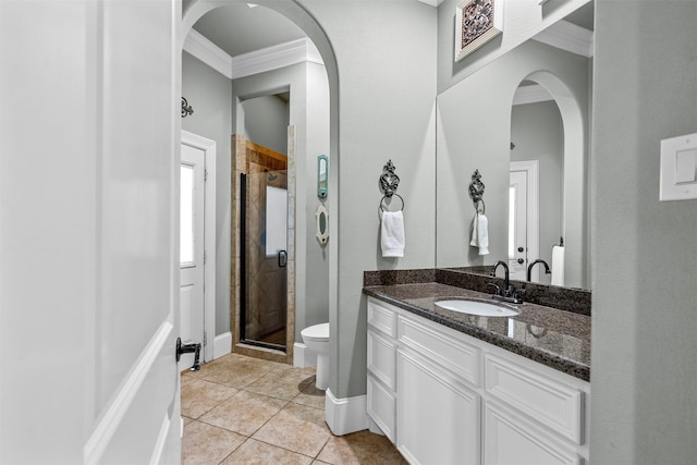 9030 Royal Crest Ln, Richmond, TX 77469 - bathroom featuring crown molding, vanity, a stall shower, and tile patterned flooring