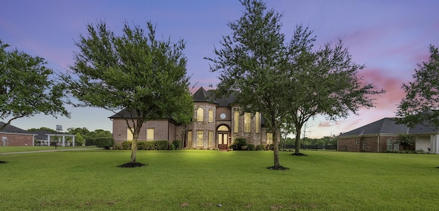 9030 Royal Crest Ln, Richmond, TX 77469 - view of front facade with a yard, brick siding, and stone siding