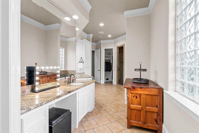 9030 Royal Crest Ln, Richmond, TX 77469 - kitchen with ornamental molding, light stone countertops, white cabinets, recessed lighting, and tasteful backsplash