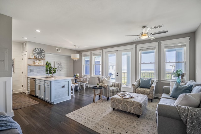 4221 Pointe W Dr Unit 302, Galveston, TX 77554 - living room featuring dark wood-type flooring, recessed lighting, ceiling fan, and baseboards