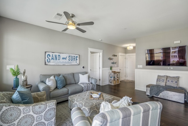 4221 Pointe W Dr Unit 302, Galveston, TX 77554 - living room with wood finished floors, ceiling fan, and wainscoting