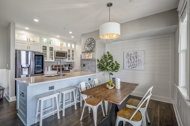 4221 Pointe W Dr Unit 302, Galveston, TX 77554 - dining space with dark wood finished floors, recessed lighting, and a chandelier