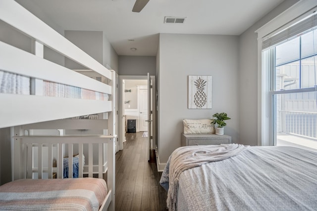 4221 Pointe W Dr Unit 302, Galveston, TX 77554 - bedroom with dark wood-style floors and ceiling fan