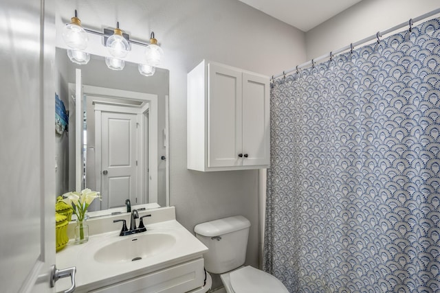 4221 Pointe W Dr Unit 302, Galveston, TX 77554 - full bathroom featuring toilet, vanity, and a shower with shower curtain