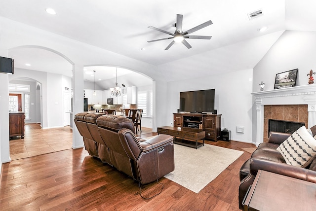2911 Fair Chase Dr, Katy, TX 77494 - living room with arched walkways, ceiling fan, wood finished floors, vaulted ceiling, and recessed lighting