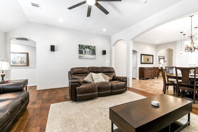 2911 Fair Chase Dr, Katy, TX 77494 - living room with arched walkways, ceiling fan, hardwood / wood-style flooring, lofted ceiling, and a chandelier