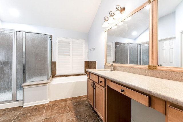 2911 Fair Chase Dr, Katy, TX 77494 - bathroom with vanity, a shower stall, vaulted ceiling, a garden tub, and stone tile floors