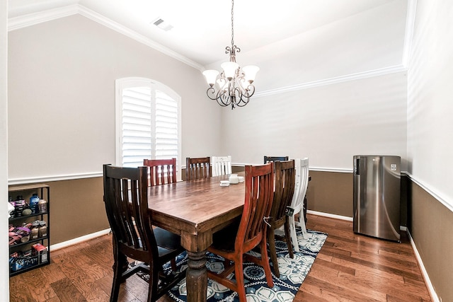 2911 Fair Chase Dr, Katy, TX 77494 - dining space featuring a chandelier, wood finished floors, ornamental molding, baseboards, and lofted ceiling