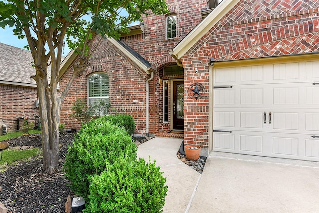 2911 Fair Chase Dr, Katy, TX 77494 - doorway to property with brick siding, a garage, and driveway