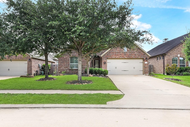 2911 Fair Chase Dr, Katy, TX 77494 - view of front of house featuring brick siding, a front yard, concrete driveway, and a garage