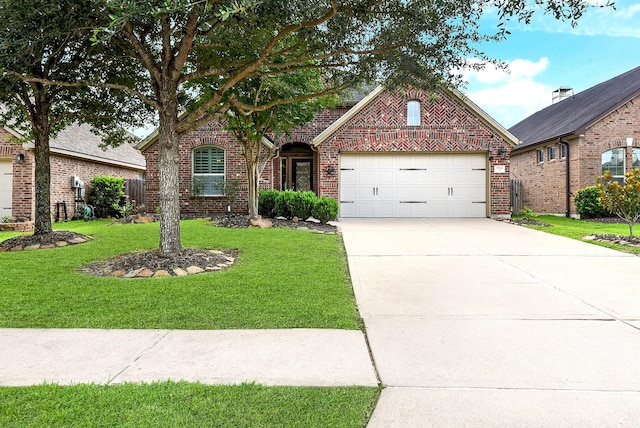 2911 Fair Chase Dr, Katy, TX 77494 - view of front of property with brick siding, a front yard, a garage, and driveway