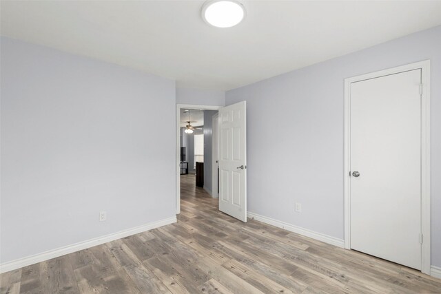 15119 Plaza Libre Dr, Houston, TX 77083 - unfurnished bedroom with light wood finished floors and baseboards