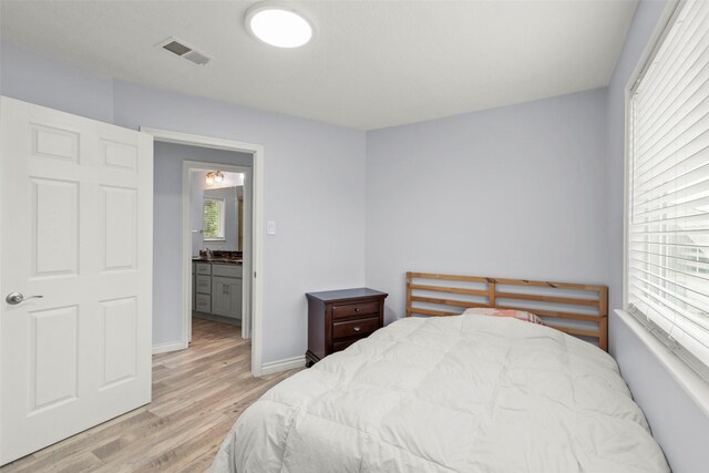 15119 Plaza Libre Dr, Houston, TX 77083 - bedroom with light wood-style flooring and baseboards