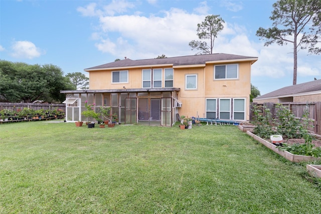 15119 Plaza Libre Dr, Houston, TX 77083 - rear view of house with a vegetable garden and a sunroom