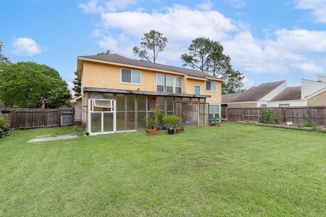 15119 Plaza Libre Dr, Houston, TX 77083 - rear view of house with a sunroom, stucco siding, and central AC
